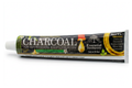 Tube of charcoal toothpaste on a white background
