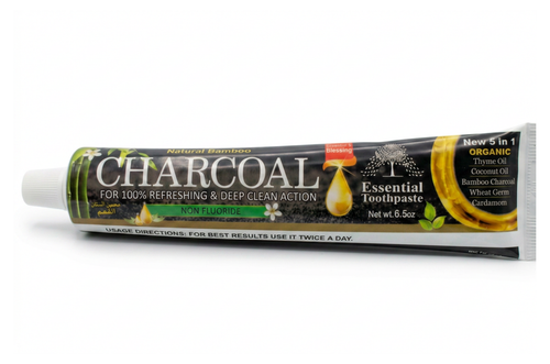 Tube of charcoal toothpaste on a white background